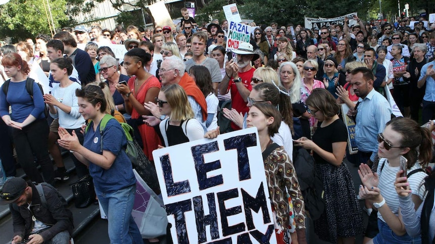 Protesters hold a sign saying 'Free the Children' at a protest in Melbourne