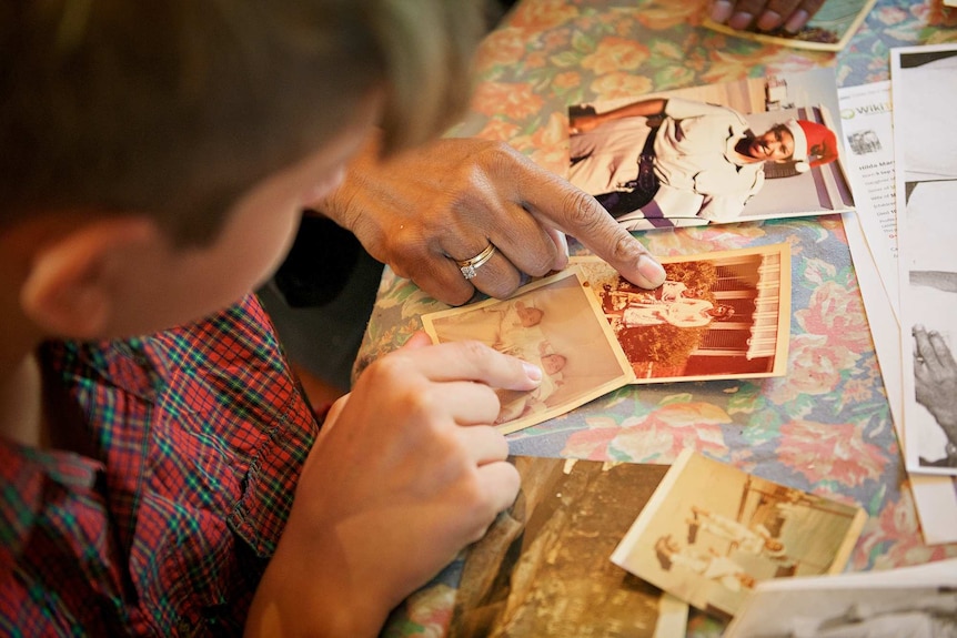 Jack Liddle looks at old family photos.
