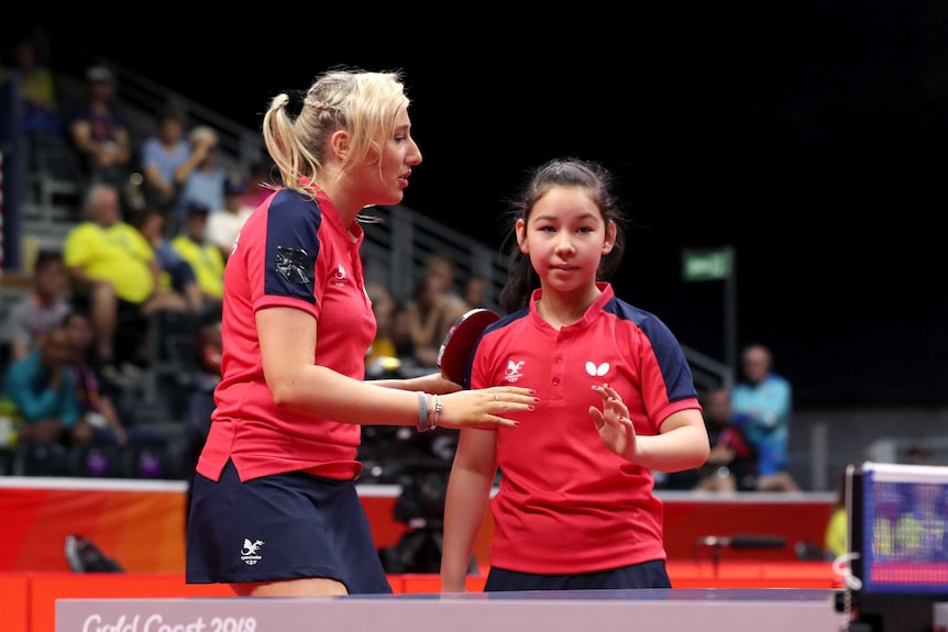 Welsh table tennis player Charlotte Carey encourages Anna Hursey