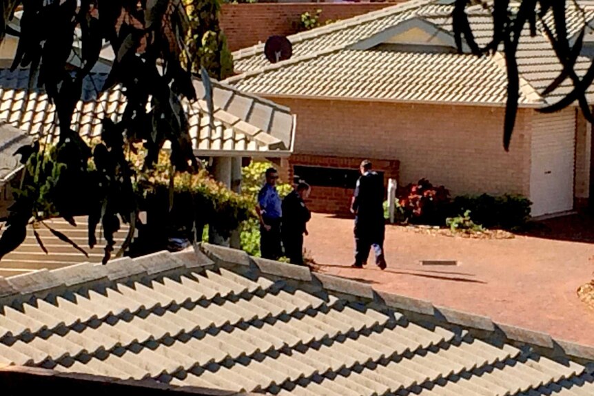 Police at the Geraldton unit where a 34-year-old man died