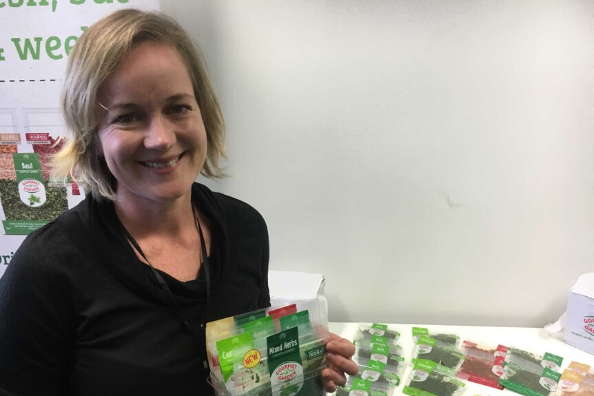 Jacqui Wilson-Smith poses with some of Gourmet Garden's products.