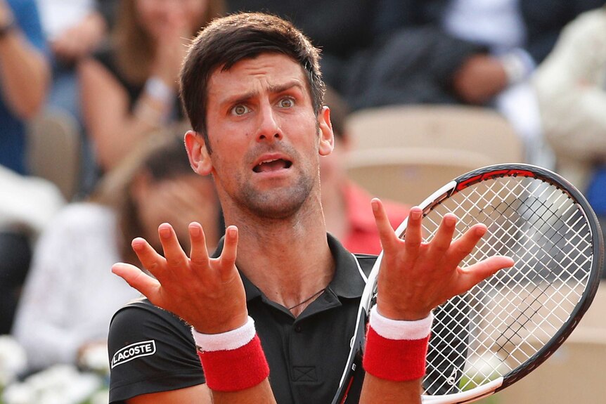 Serbia's Novak Djokovic reacts after missing a shot against Marco Cecchinato at the French Open.