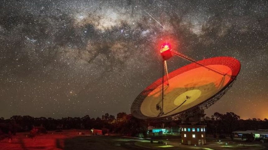 The Parkes Radio Antennae at night with stars in background