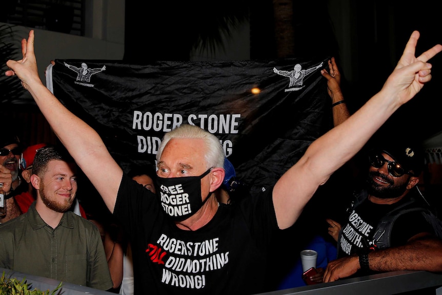 Roger Stone wearing a face mask that reads: Free Roger Stone.