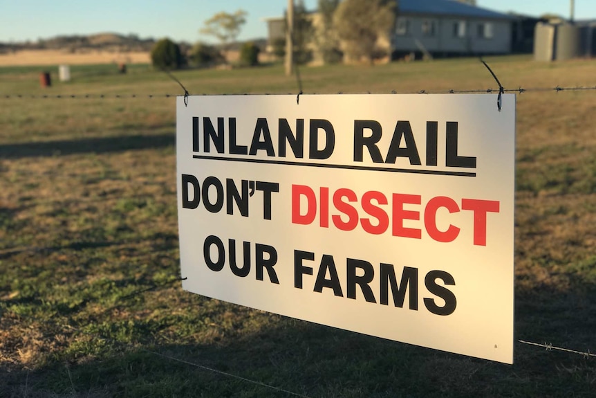 Sign reads: Inland Rail: Don't dissect our farms