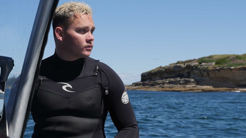 Gamay Ranger Bryce Liddell sits on his boat at Botany Bay.