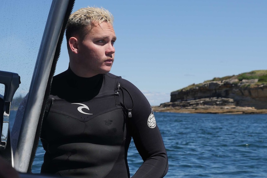 Gamay Ranger Bryce Liddell sits on his boat at Botany Bay.