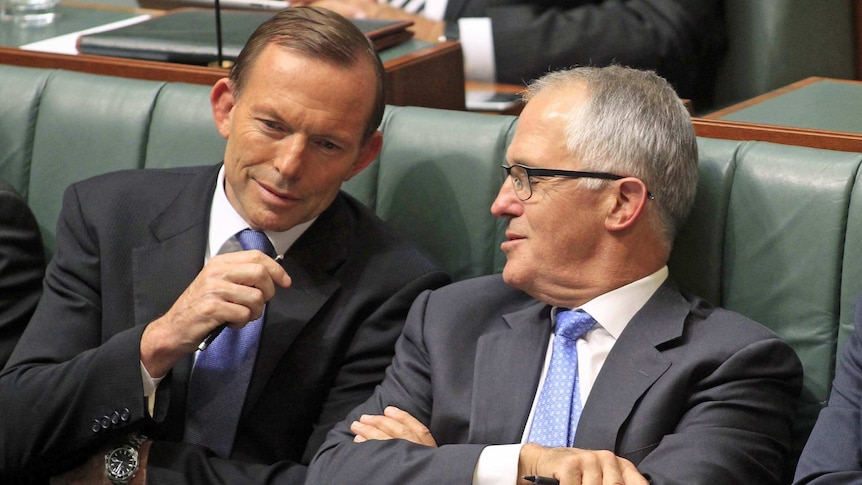 Tony Abbott and Malcolm Turnbull speak during Question Time