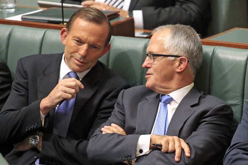 Tony Abbott and Malcolm Turnbull speak during Question Time