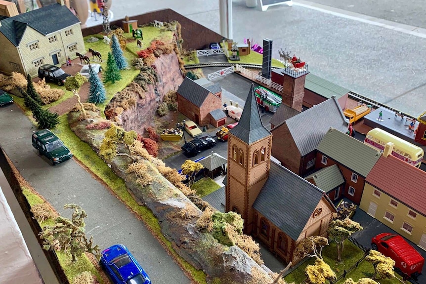A miniature town handcrafted by a hobby carpenter, features railway station, pub, church and other buildings.