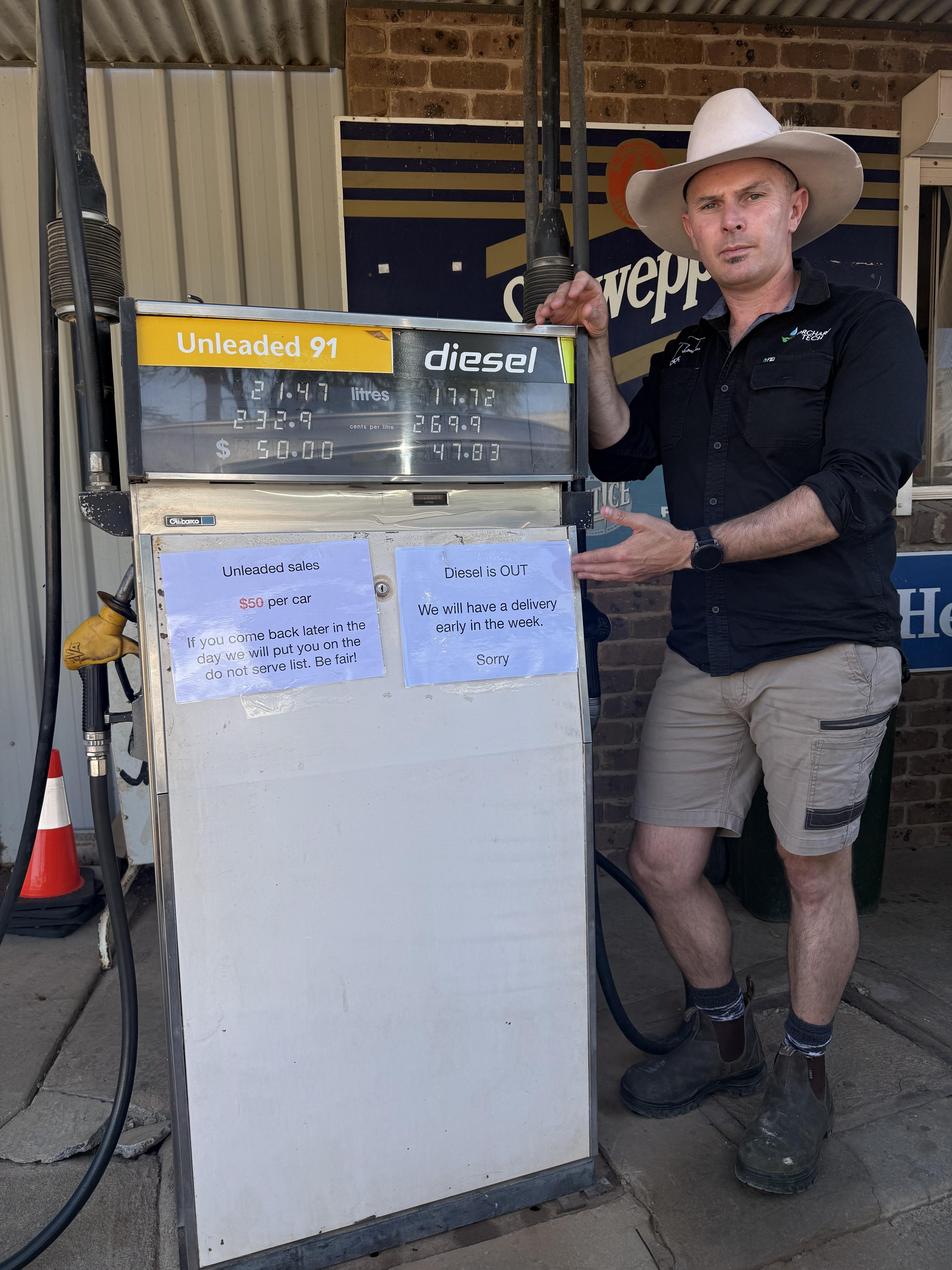 Nathan Falvo near a fuel pump.