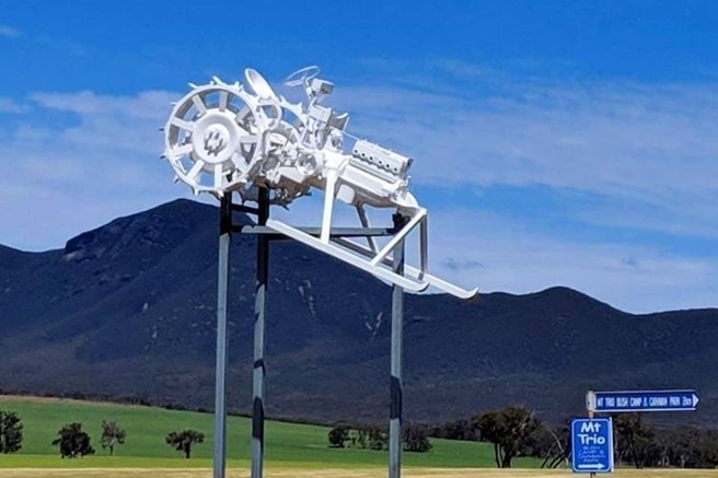 A white tractor in front of the Stirling Range.