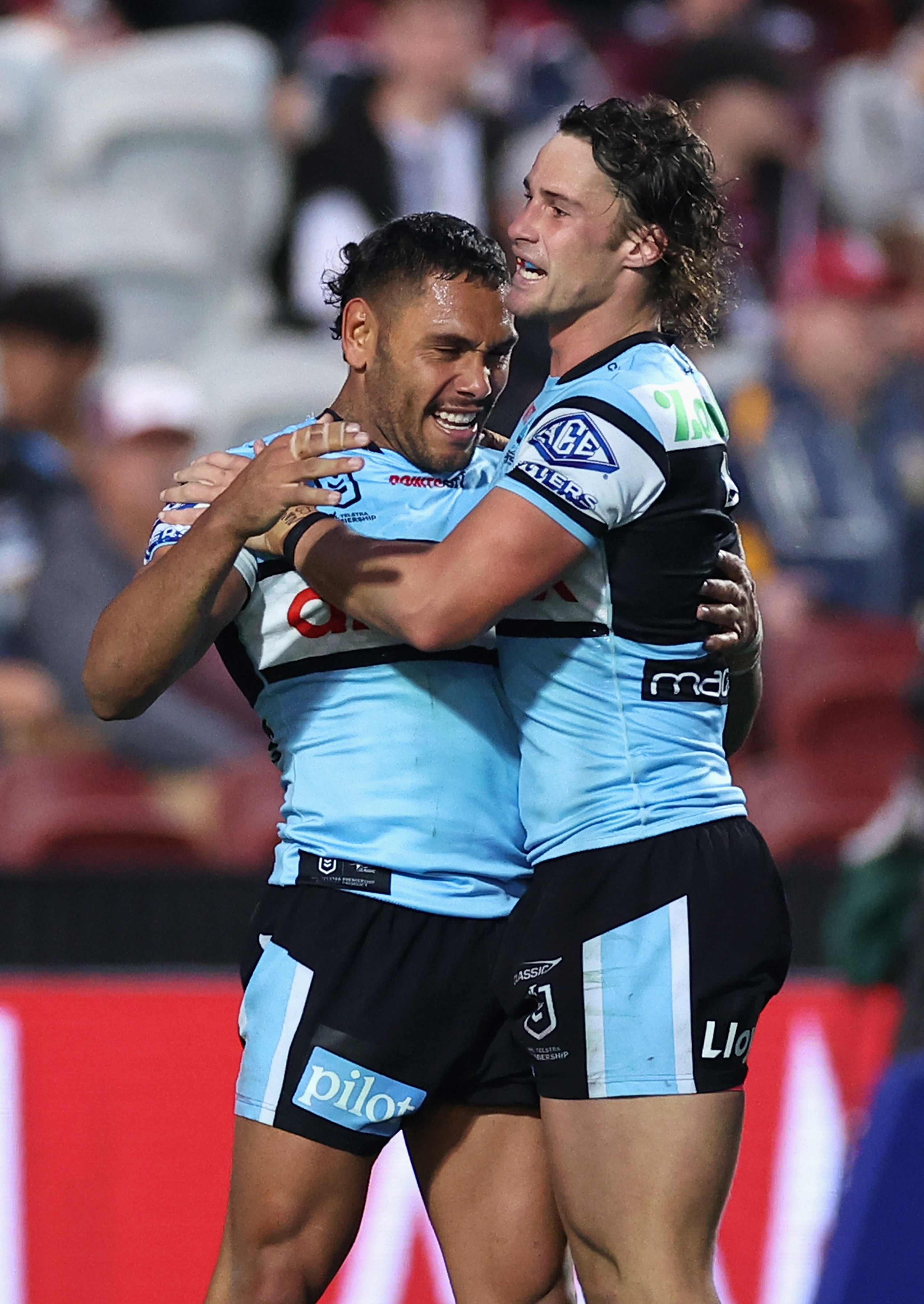 Jesse Ramien hugs Nicho Hynes