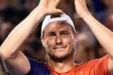 Amazing career ... Lleyton Hewitt reacts to the crowd following his loss to David Ferrer