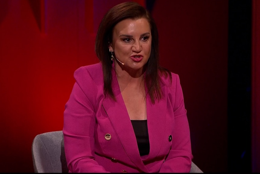 Jacqui Lambie wears a pink suit.