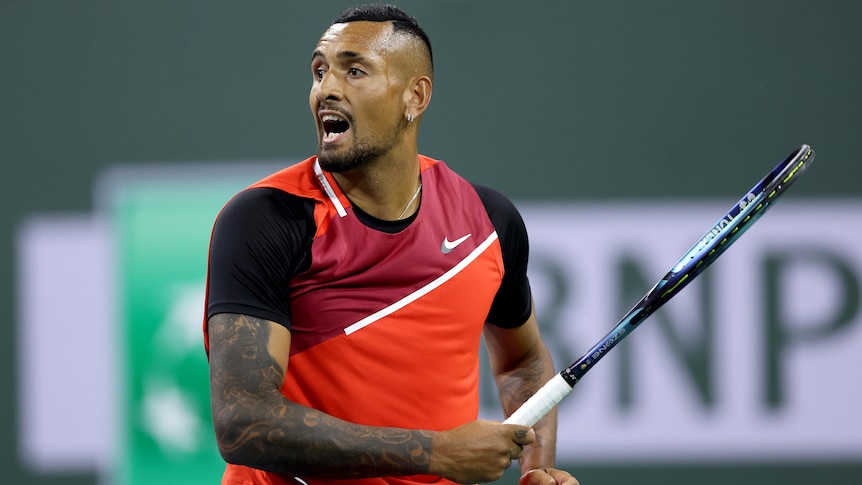 An Australian male tennis player follows through after hitting a forehand in Indian Wells.