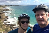 Sunshine Coast man Greg Smith with his wife Sue wearing bike helmets.