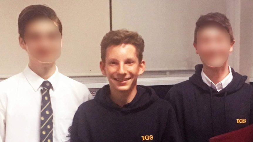 boy smiling in a classroom