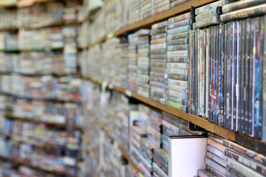 close up on shelves full of DVDs