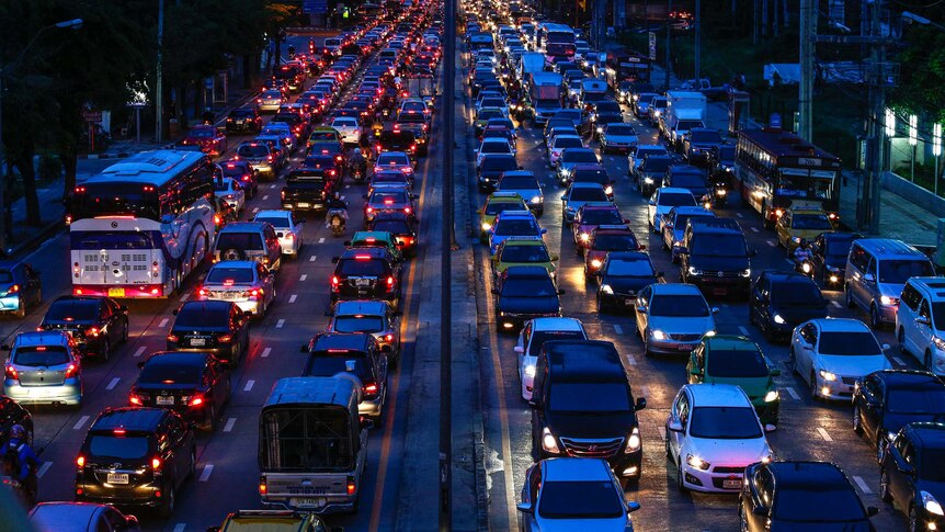 Cars are seen stuck in a traffic jam at Rama 9 road in Bangkok September
