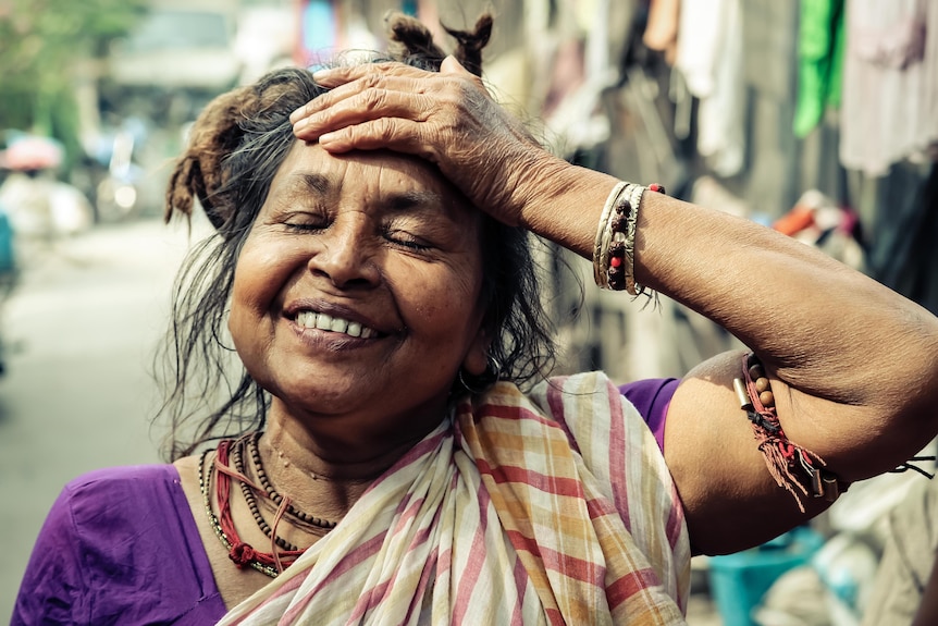 An older woman in the warm sunshine