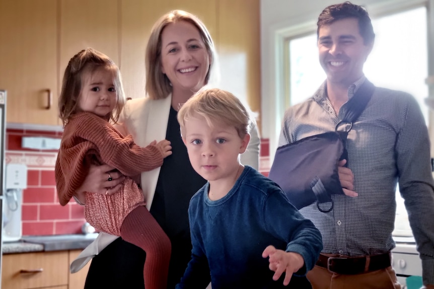 Photo of Caitlin Wilson and Jonathon Peatfield with their children Matilda and Harrison.