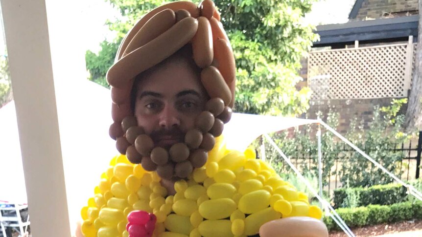 Man dressed head to toe in balloons to create a character