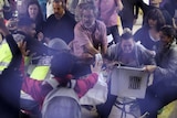 Spanish National Police officers in plain clothes try to snatch a ballot box.