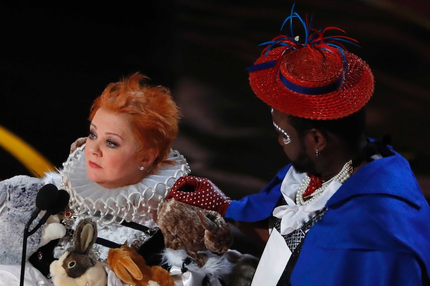 Melissa McCarthy and Brian Tyree Henry in costume on stage