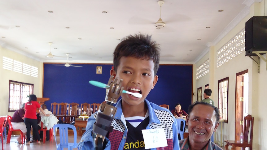 Landmine victim brushing teeth
