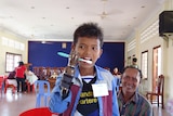 Landmine victim brushing teeth