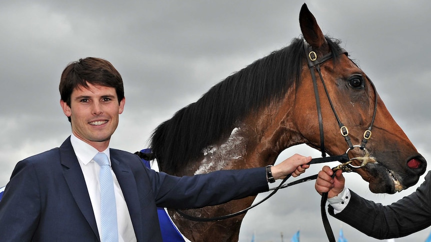 Trainer James Cummings poses with Precedence at Moonee Valley on October 26, 2013.