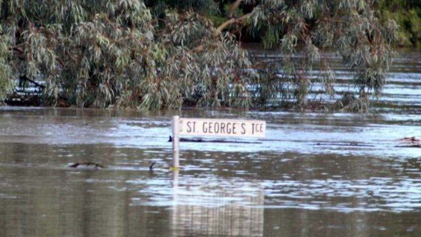Floodwaters in St George have already passed the town's previous record set in 1890.
