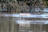 Floodwaters in St George have already passed the town's previous record set in 1890.