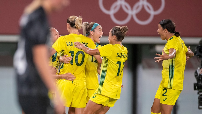 Australian Matildas Tameka Yallop, Emily van Egmond, Ellie Carpenter, Kyah Simon and Sam Kerr celebrate an Olympic goal.