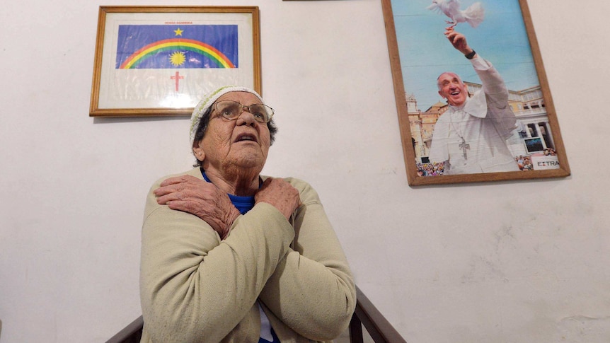 A Rio de Janeiro woman waits for the visit of Pope Francis