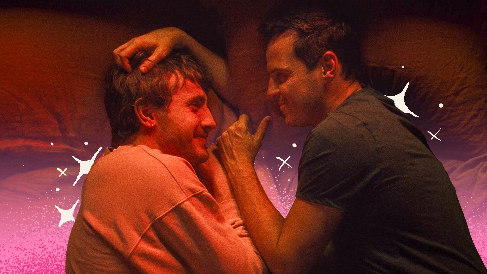 Paul Mescal and Andrew Scott look lovingly into each other's eyes while in bed, fully clothed.