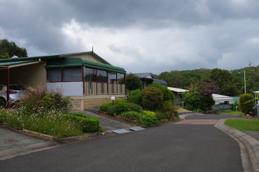 A house with a stormy cloud on top