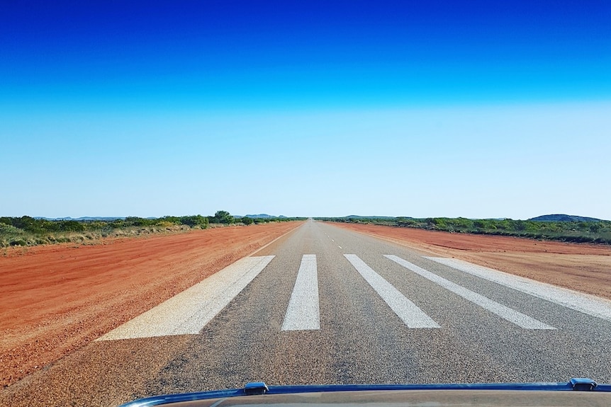 A highway stretches off to the horizon.