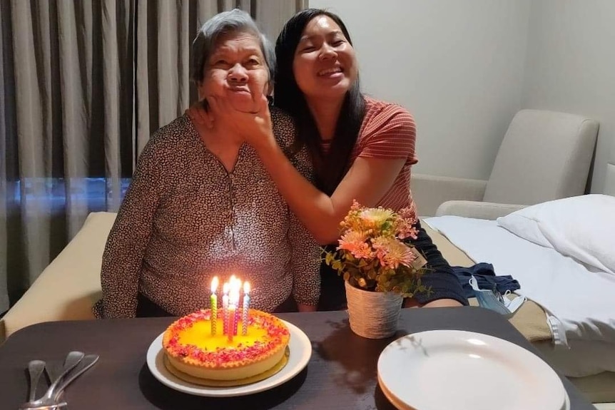 Ai-Lin Chang celebrates her grandmother's birthday with cake and candles.