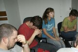 Missionaries charged: the group prays before hearing the charges