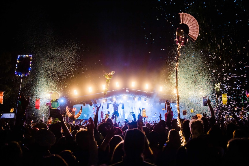 A night-time festival crowd is showered in confetti at Golden Plains festival 2023