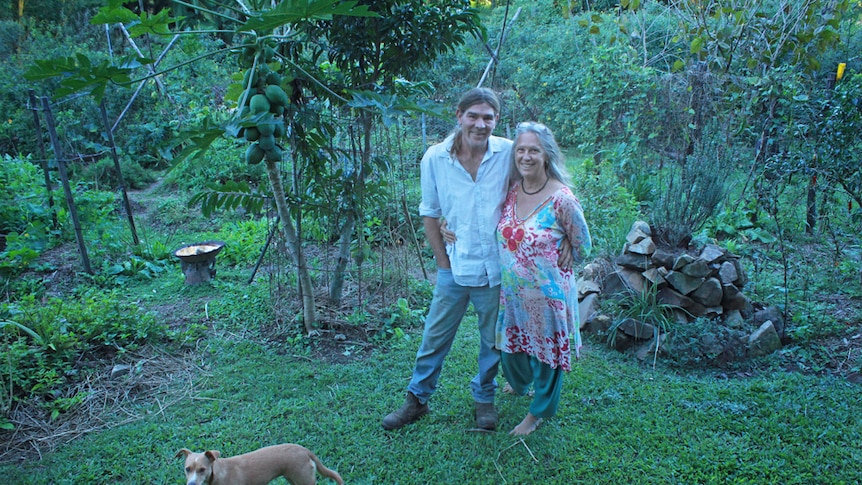 Luke Mathews and Harmony Larkins in their garden at Finch Hatton