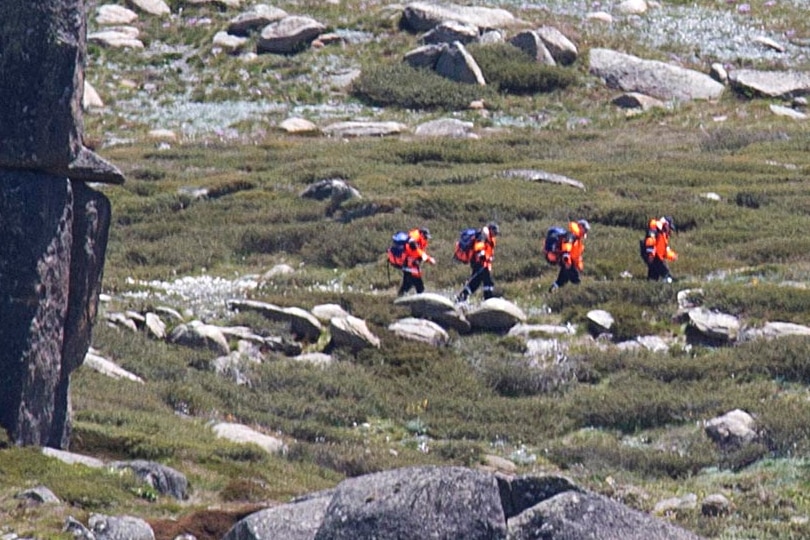 A search party heads off to find the missing hikers.