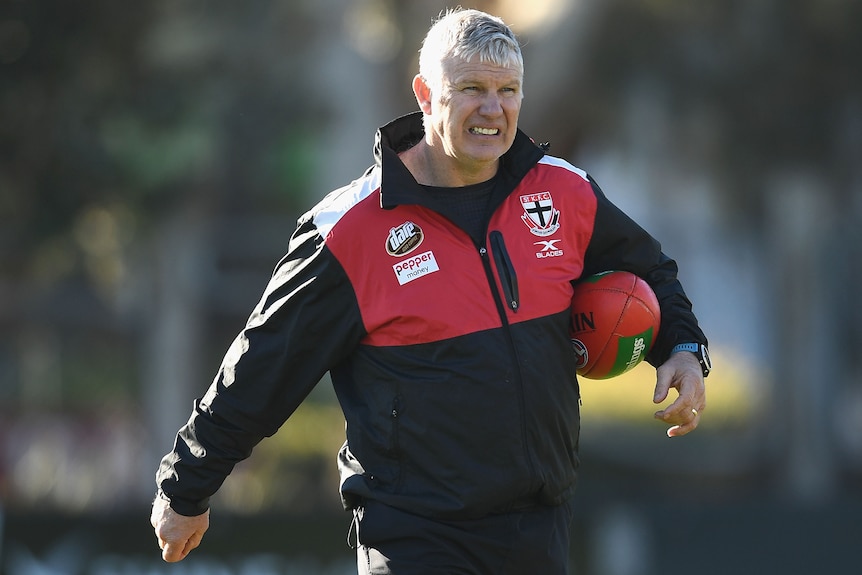 Danny Frawley holding a football under his left arm at a St Kilda training session in 2017.