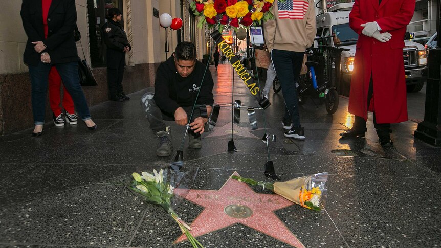 Flowers are placed on actor Kirk Douglas' star on the Hollywood Walk of Fame.