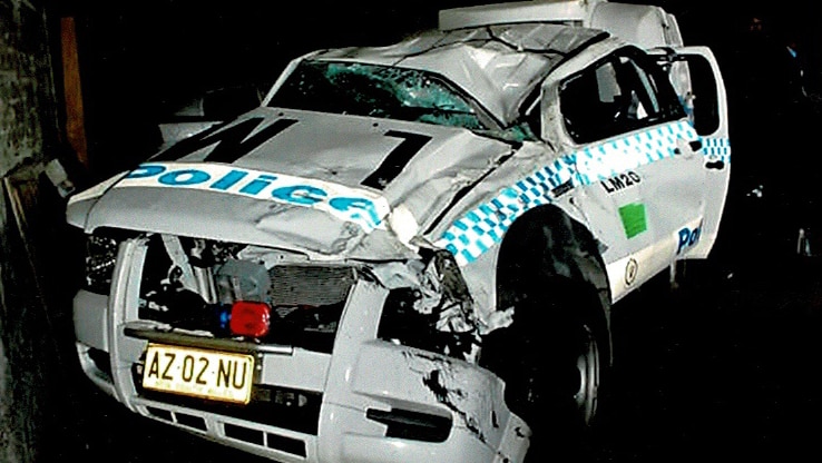 A NSW police squad car appears damaged after a crash.