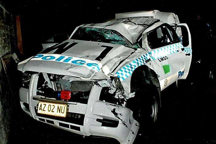 A NSW police squad car appears damaged after a crash.