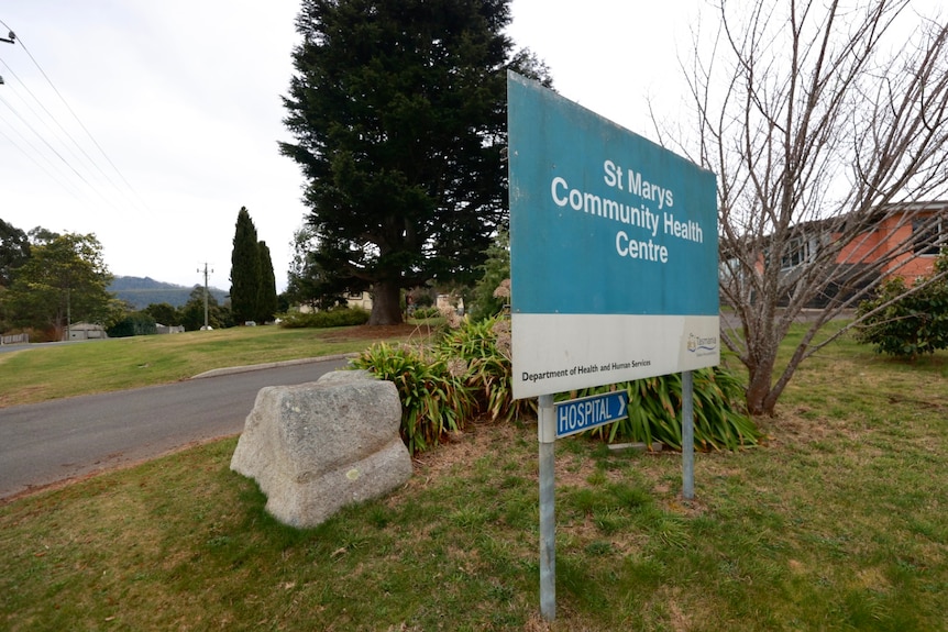 A sign next to a road reads: St Marys community health centre 