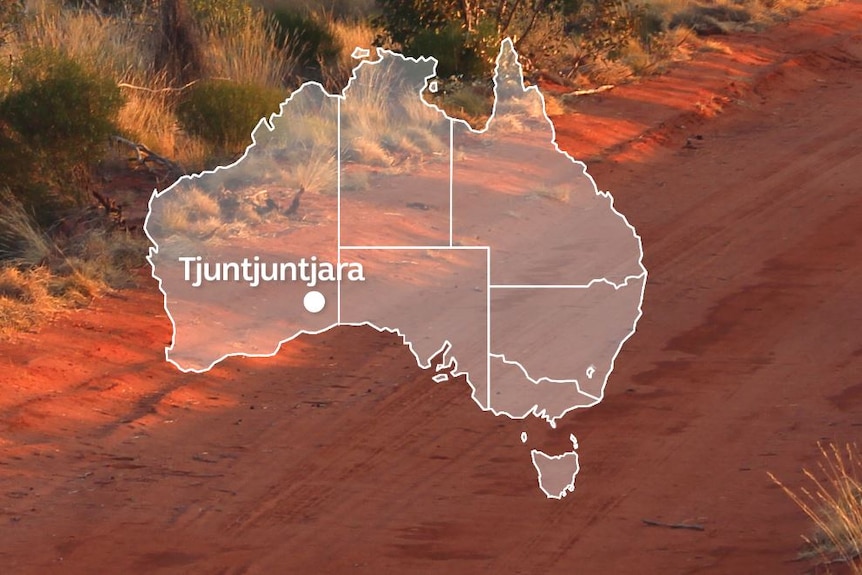 A map of Australia with Tjuntjuntjara, in south-east Western Australia marked, superimposed over an image of a red dirt road.